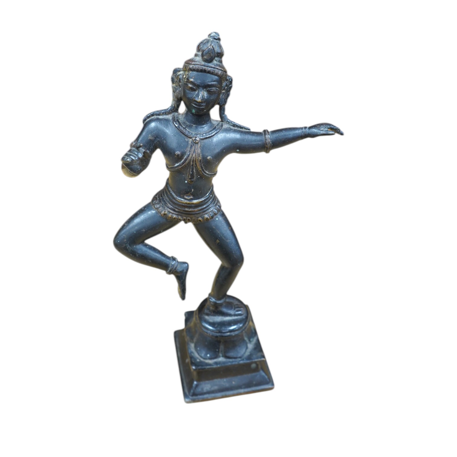 A Tibetan bronze dancing deity, 23cm high. Condition - fair